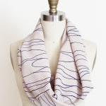 Infinity Scarf In Beige Fabric With Blue Lines..
